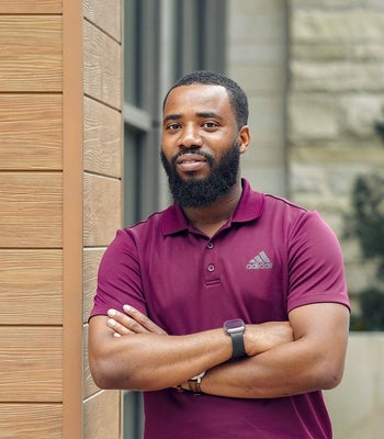 Portrait of Sam Ayansola, Realtor.